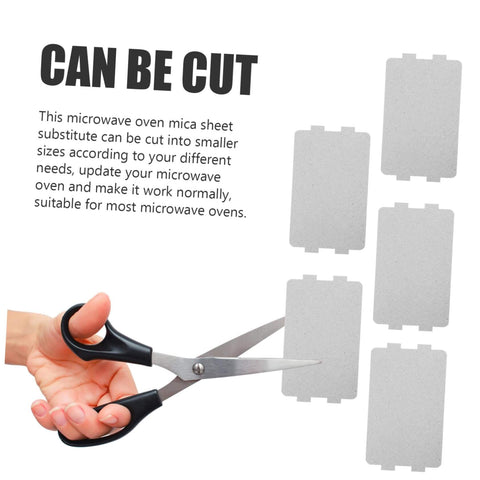 Scissors cutting 10 Piece Microwave Mica Insulation Sheets For Easy To Cut To Fit No Fuss Heat Resistant Waveguide Covers