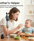 Mother using Powerhouse Immersion Hand Blender 12 Speed With 1000W Motor Titanium Reinforced Stainless Steel Blades 3 In 1 System Including Whisk And Milk Frother Black For Smoothies Soups And Sauces to prepare baby food in kitchen