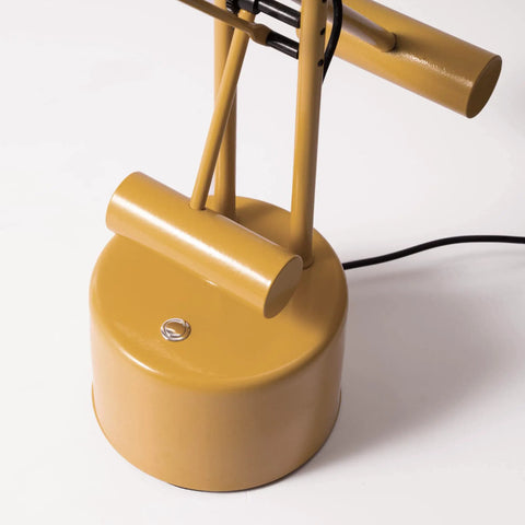 Base of Halotech 29-Inch LED Desk Lamp With Counter-Balance Arm, yellow finish, showing touch dimmer on sleek steel design