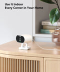 Outdoor Indoor Security Cam 1080P 2.4Ghz WiFi Color Night Vision Spotlight IP65 Waterproof on a wooden table indoors