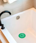 Heavy Duty Stainless Steel Hair Catcher For Shower Drain And Bathtub Tub With Solid Anchor Block in white bathtub.