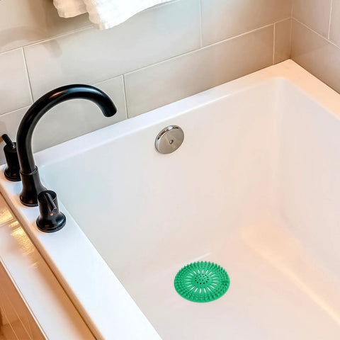 Heavy Duty Stainless Steel Hair Catcher For Shower Drain And Bathtub Tub With Solid Anchor Block in white bathtub.