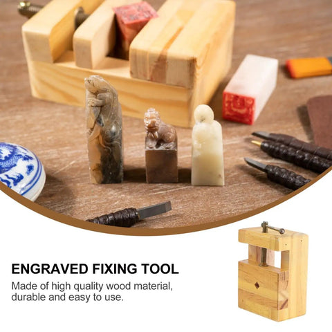 Adjustable Wood Carving Tool Clamp For Engraving And Seal Carving with mini bench clamp and carved stone seals on a wood table