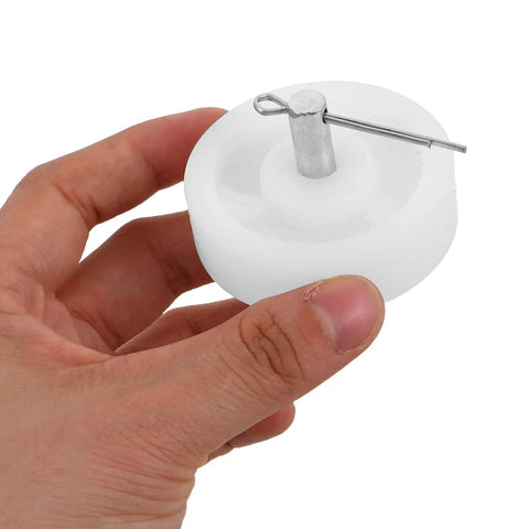 Hand holding a single wheel from Four Pack White Nylon Furniture Casters Wheels For Drawers And File Cabinets No Squeak Glide Heavy Duty