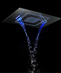 Top Shelf Thermostatic Rainfall Shower Setup With LED Wall Mount Handle And Dual Spray Handheld Copper Core Stainless Steel Ceiling Head streaming water with blue LED accents.