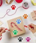 Hands wrapping a gift with Dog Paw Print Stickers Roll 500 Self Adhesive Paw Labels Colorful Animal Shape Wall Decals