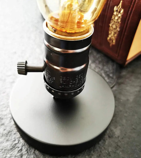 Close-up of Vintage Edison Desk Lamp With Industrial Loft Vibe, E26/E27 Plug In On Off Switch, on black metal base.
