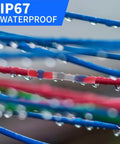 Close-up of IP67 rated waterproof connectors in blue, red, and green wires, showcasing drops of water for 1118 Piece Waterproof Solder Seal Wire Connectors Kit Heavy Duty Heat Shrink Butt Connectors Assorted AWG Terminals For Marine Automotive Wiring Easy Install With Great Bang For Buck.