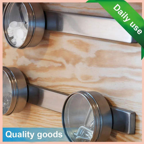 16-pack neodymium magnets with double-sided adhesive; silver metal discs mounted on wood surface (angled view)