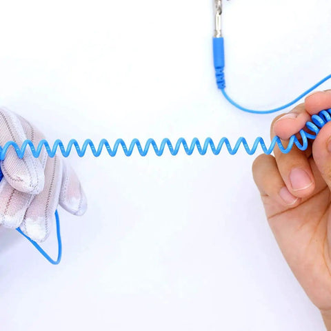 Adjustable Anti Static Wrist Strap With Grounding Wire shown in use with alligator clip, demonstrates flexibility and function for electronics work.