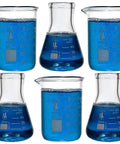 Lab Style Shot Glass Set With Six Pieces Including Three Beakers And Three Erlenmeyer Flasks, 50ml Each, filled with blue liquid.