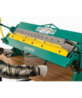 User operating 48 Inch Pan And Box Brake For 16 Gauge Sheet Metal, Heavy Duty Bench Type with full trussed rigidity and 16 interchangeable fingers.