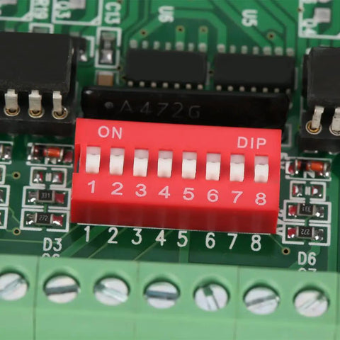 Close-up of 8 Channel Level Converter For 5V To 24V And 24V To 5V NPN PNP To NPN Square Wave with DIP switches and optocoupler.
