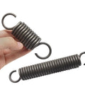 Heavy Duty 2pcs Steel Tension Springs With 3mm Wire For Tough DIY Projects held in hand, showing 20mm outer diameter and durable design.