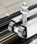 Heavy Duty 4 Wheel Trolley Assembly Rollers With Rust Resistant Galvanized Body High Carbon Steel Core mounted on overhead tracks.