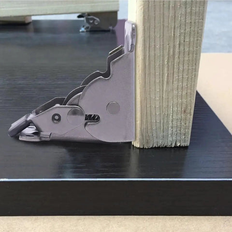 Four Pack Heavy Duty Self Locking Furniture Hinges Engineered For 90 Degree Right Angle Setups close-up view on table edge