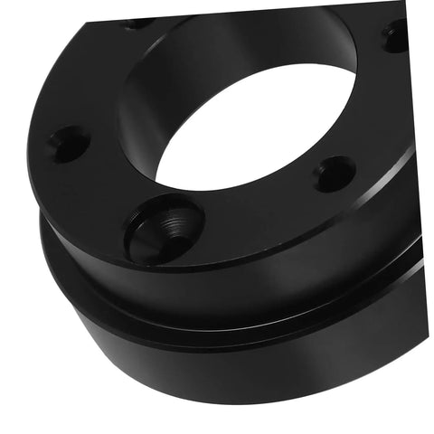 Close-up of black Riser Adapter Plate for Racing Cars, Durable Bolt On Car Accessory That Boosts Style and Fit.