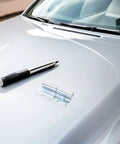 Heavy Duty Left Side Truck Cargo Box Panel Hinges Two Sets on silver car hood beside pen for installation details.