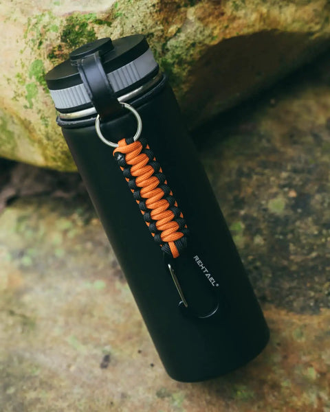 Heavy Duty Carabiner Key Chain Set With Military Braided Paracord And Hook Clip D Ring, 2 Pack In Black Orange on a bottle