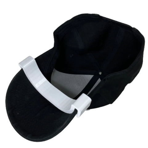 Hat Shaper Brim Bender Set for Perfect Curve on Fitted Hats Two Size Adjustable Tools for Custom Hat Shape Diy Friendly Build for Easy Use and Long Lasting Performance Made in USA showing curved tool on black hat.