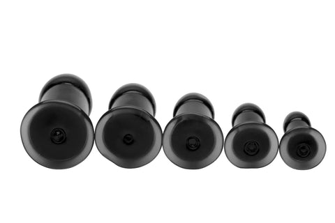 Five Piece Silicone Butt Plug Training Kit with graduated anal dilators shown from the base view, tapered insertion tips visible