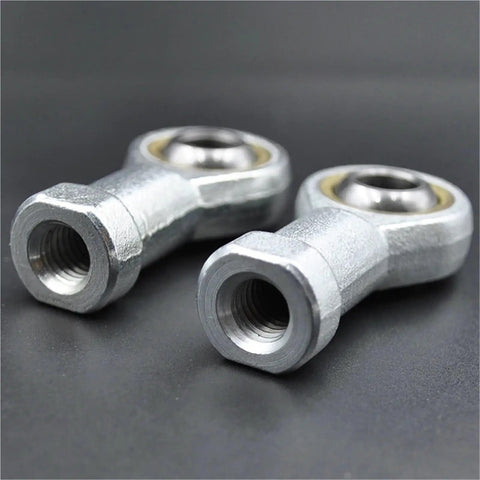 Built Tough Self Aligning Rod End Bearings With Smooth Threading Male Female Joint Rods close-up of threaded steel rod ends.