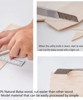 Cutting 100% natural balsa wood sheets, one sixteenth inch thick, 4 by 12 inches, perfect for DIY crafts and model making.