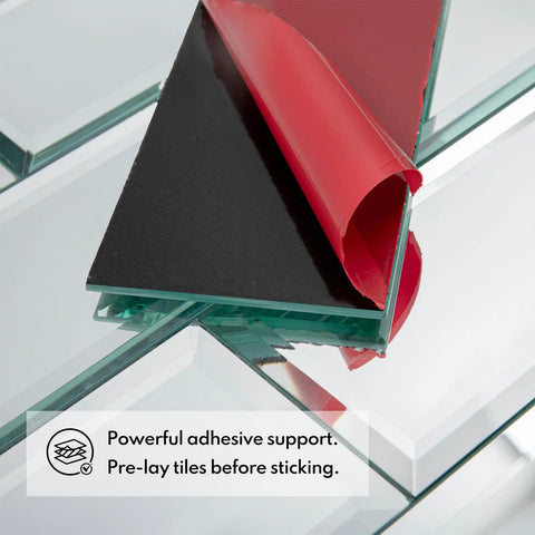 Close-up of 3x6 inch Mirror Peel And Stick Subway Tile Beveled Glass Backsplash showing self-adhesive layer with red peel-off cover.