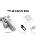 Osmo Mobile 7 Gimbal Stabilizer with storage pouch, USB-C power cable, and magnetic phone clamp displayed in the box.