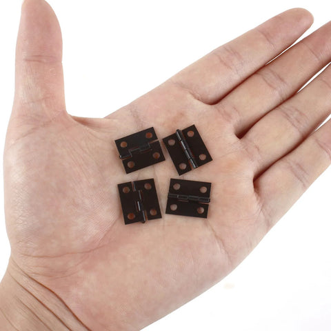 Hand holding Tiny 18x15mm Wooden Box Hinges Set With 200 Screws For DIY Jewelry Boxes Black Small Folding Butt Hinges