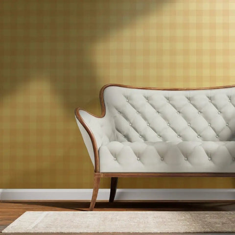 Top Shelf Buffalo Check Gold Metallic Wallpaper With Fibrous Texture For High End Indoor Spaces in a modern living room behind a tufted sofa.