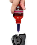 Applying Purple Threadlocker High Strength Oil Resistant Anaerobic Adhesive For Screws And Bolts Locking Solution to a mechanical part.