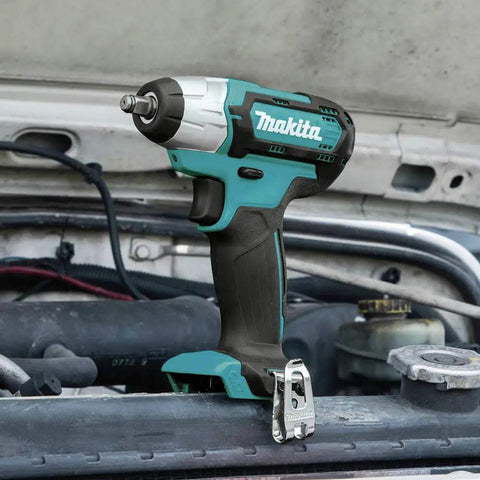 12V Max CXT Impact Wrench 3/8 Inch Drive on engine, ultra compact at 6-3/8 inches, weighs just 2.3 lbs, one-handed tool
