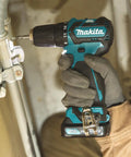 Badass 12v Max Lithium Ion Cxt Brushless Drill Driver Featuring Electric Brake And Bright Led Lamp Keyless Chuck Compact Heavy Duty Cordless Tool Built Different For Real World Projects in use, detailed close-up.