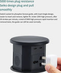 Slick Smart Pop Up Desk Power Strip With Built In Wireless Charging And Auto Lift Design Flame Retardant hidden layout showcasing plug connections.