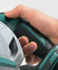 Close-up of hand gripping 18V LXT Brushless Cordless Circular Saw Tool Only With Six And A Half Inch Blade Automatic Speed Change 5000 RPM Pro Grade Power For Framing And Trim Lightweight Durable No Battery Included handle, showcasing control features.