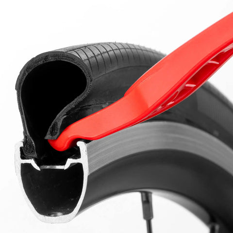 Close-up of Three Pack Bicycle Tire Levers For Road And Mountain Bikes Heavy Duty Self Lubricating Plastic Rim Safe Levers in use