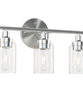 Modern 3-Light Vanity Fixture With Clear Ribbed Glass Shades In Nickel Finish For Bathroom, front view on white background.