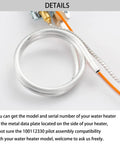 Front view of gas water heater pilot thermopile assembly; curved silver sensor tube with orange wire