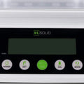 Close-up of digital analytical balance 110 g capacity with 0.001 g readability, showing control panel with buttons and LCD screen.