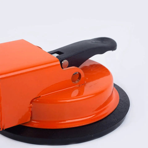 Close-up of an orange vacuum suction lifter from Heavy Duty Floor Seam Fix Kit With Vacuum Suction Lifter And Plank Grabbers For Wood Tile And Laminate Floors Secure Lifts Quick Seam Fix No Slip Installation.