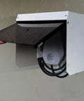 Top Shelf EV Charger Cover With Hella Tough Metal Shield For Wall Mount Stations blocking rain with steel housing.