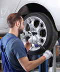 Mechanic using Beefy 3/8-Inch Drive Click Torque Wrench With 10-100 Ft-Lb / 15-135 Nm Range on car wheel