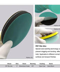 Grab These 30 Piece 5 Inch Hook And Loop Sanding Discs With Green Abrasive Film That Cut Fast And Last Long For Your Orbital Sander Doing Wet Or Dry Work Without Getting Clogged - close-up of sanding disc with black backing.