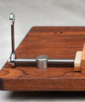 Two Pack Adjustable Bench Dog Clamps With 3/4 Inch And 20mm Posts For Woodworking on wooden benchtop, side view