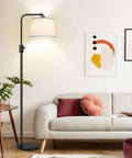 Fully Dimmable Arc Floor Lamp With 1000 Lumens LED Edison Bulb Included, black linen shade next to modern sofa in living room.