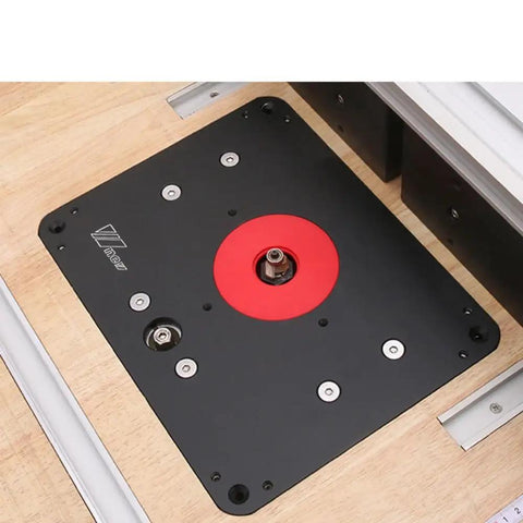 Rock Solid Heavy Duty Router Lift With Aluminum Table Insert Plate For Woodworking Shops 107 mm Plus 65 mm Rings mounted on workbench.