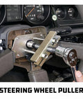 Beefy Heavy Duty Steering Wheel Puller Tool Set with yoke and screw pad removing wheel in vehicle, 14 pcs kit visible