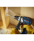 GSR18V-975CN 18V Brushless Drill Driver Bare Tool used for drilling wood with visible wood shavings