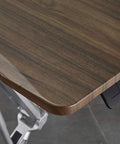 Close-up of the walnut surface on the Totally Adjustable Pneumatic Sit Stand Rolling Laptop Desk Cart, showcasing smooth edges.